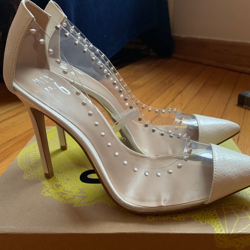 White spiked heels